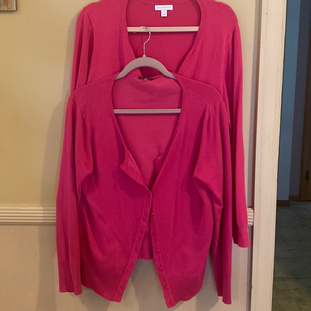 Set of 2 shades of fuchsia cardigans.